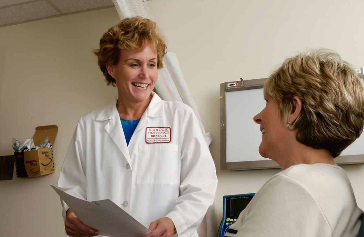 A pharmacist discussing medication with a patient